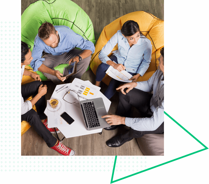 co-workers discussing while sitting down on beanbags